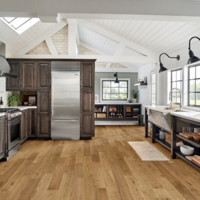 Rustic-modern kitchen showcasing wide plank flooring, exposed beams, and a warm, inviting design.